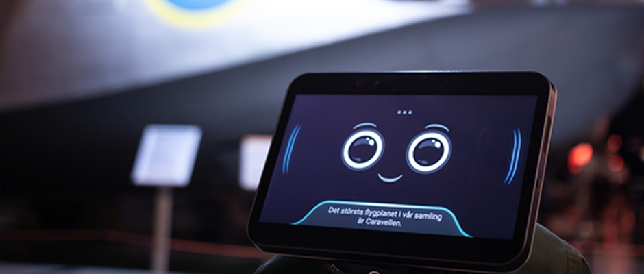 AI-roboten Elsa visar glatt ansiktsuttryck p&aring; sk&auml;rmen och svarar p&aring; fr&aring;gor.